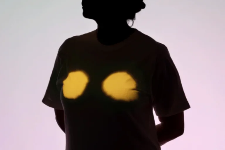Silhouette of a person with chest highlighted in yellow light