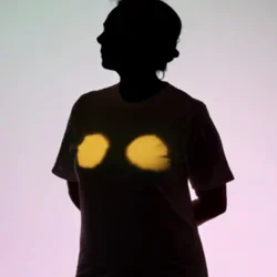 Silhouette of a person with chest highlighted in yellow light
